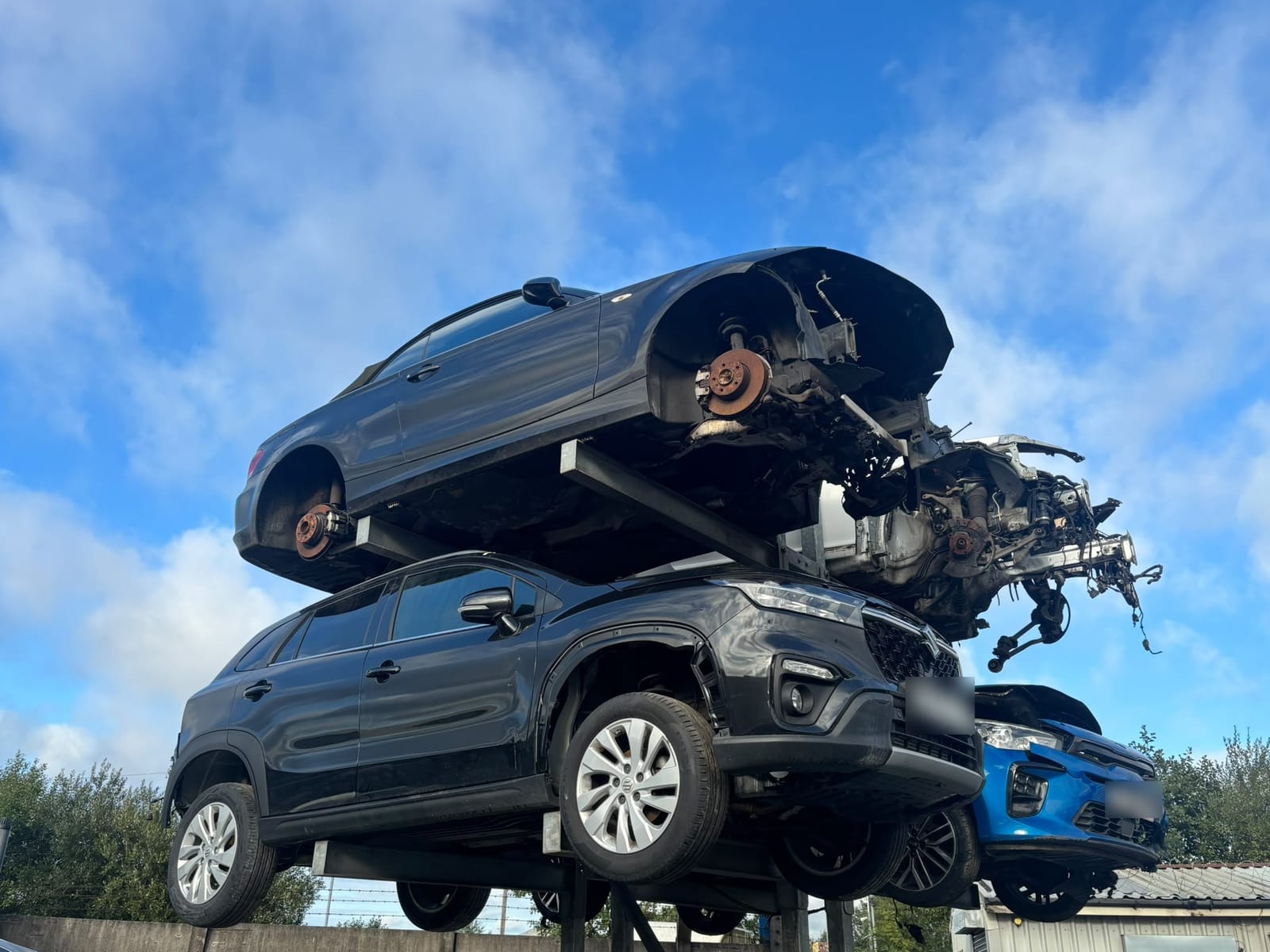 Vehicles stacked for breaking in the Allparts Rochdale yard on Chichester Street