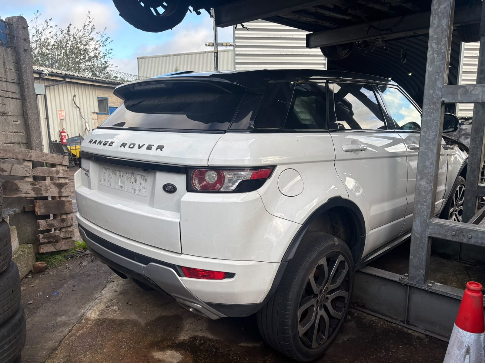 White Range Rover Evoque being broken for parts at Allparts Rochdale, Greater Manchester